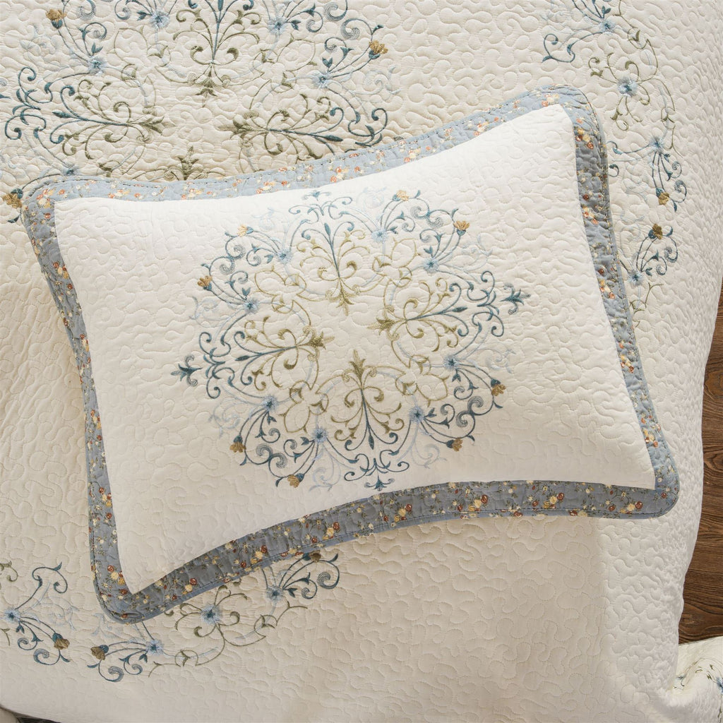 Close-up of embroidered floral pattern on pure cotton pillow sham