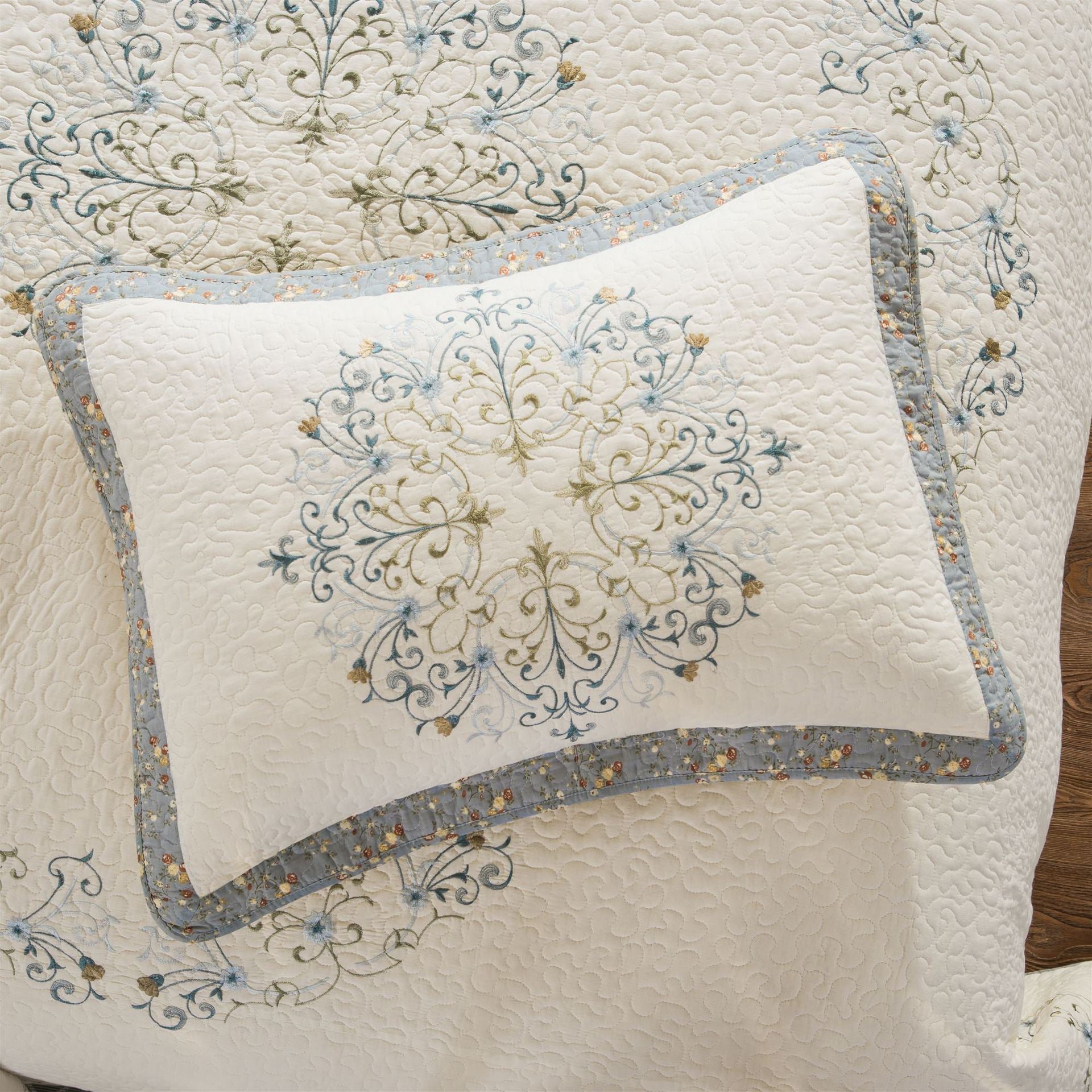 Close-up of embroidered floral pattern on pure cotton pillow sham